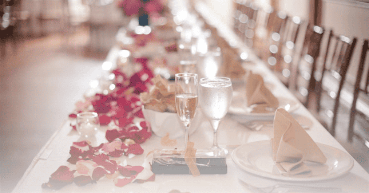 Image of a wedding dinner table demonstrating the culmination of ideas and inspiration that goes into wedding planning.